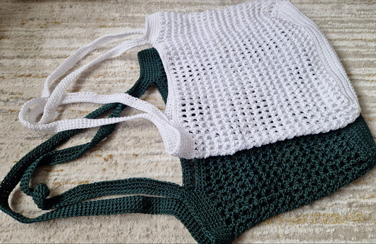 Breezy Market Crochet Tote Bags in white and green displayed side by side, showcasing their shoulder straps and style
