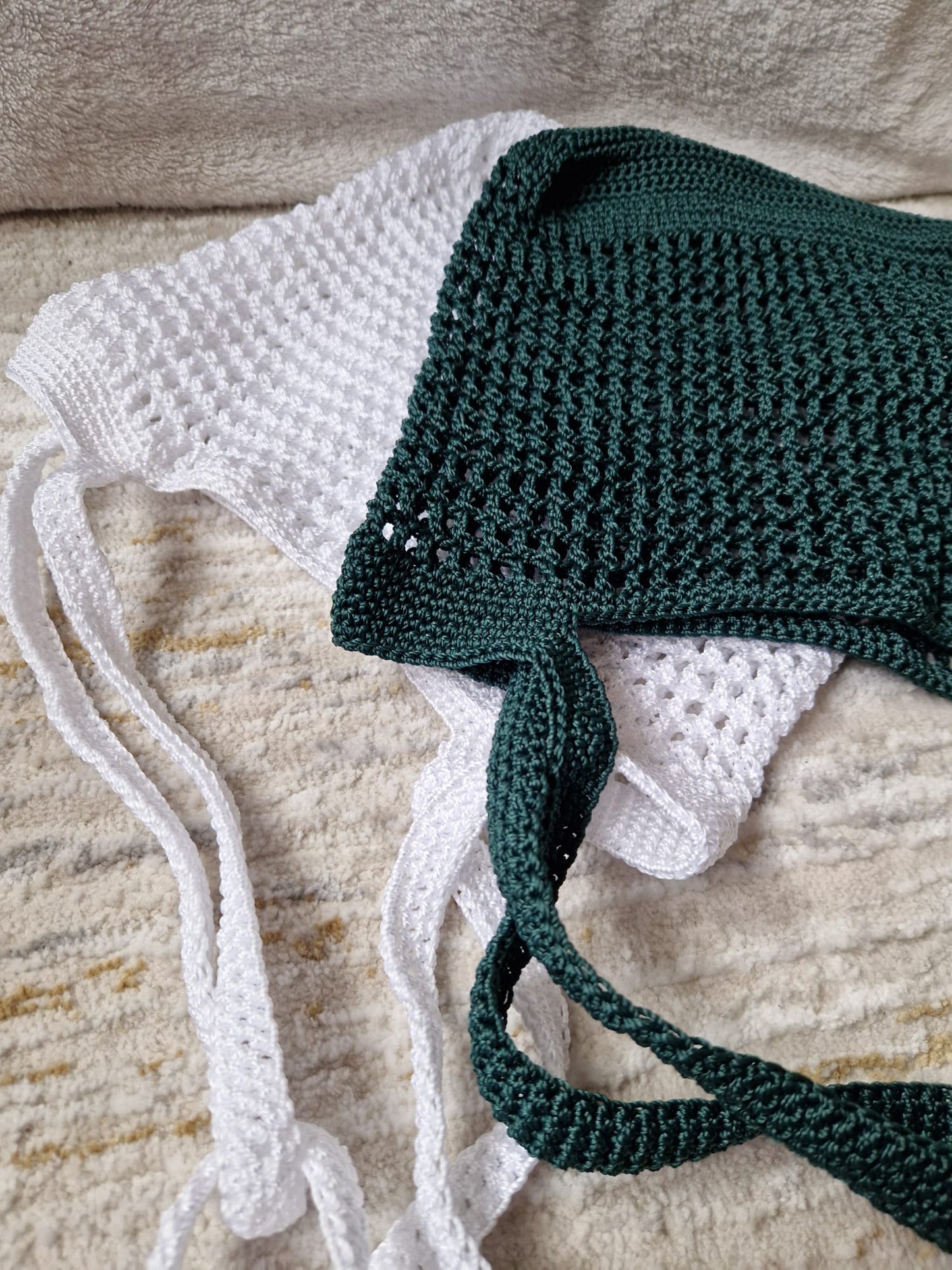 The white and green Breezy Market Crochet Totes styled together on a neutral background, ideal for a casual, eco-friendly look.