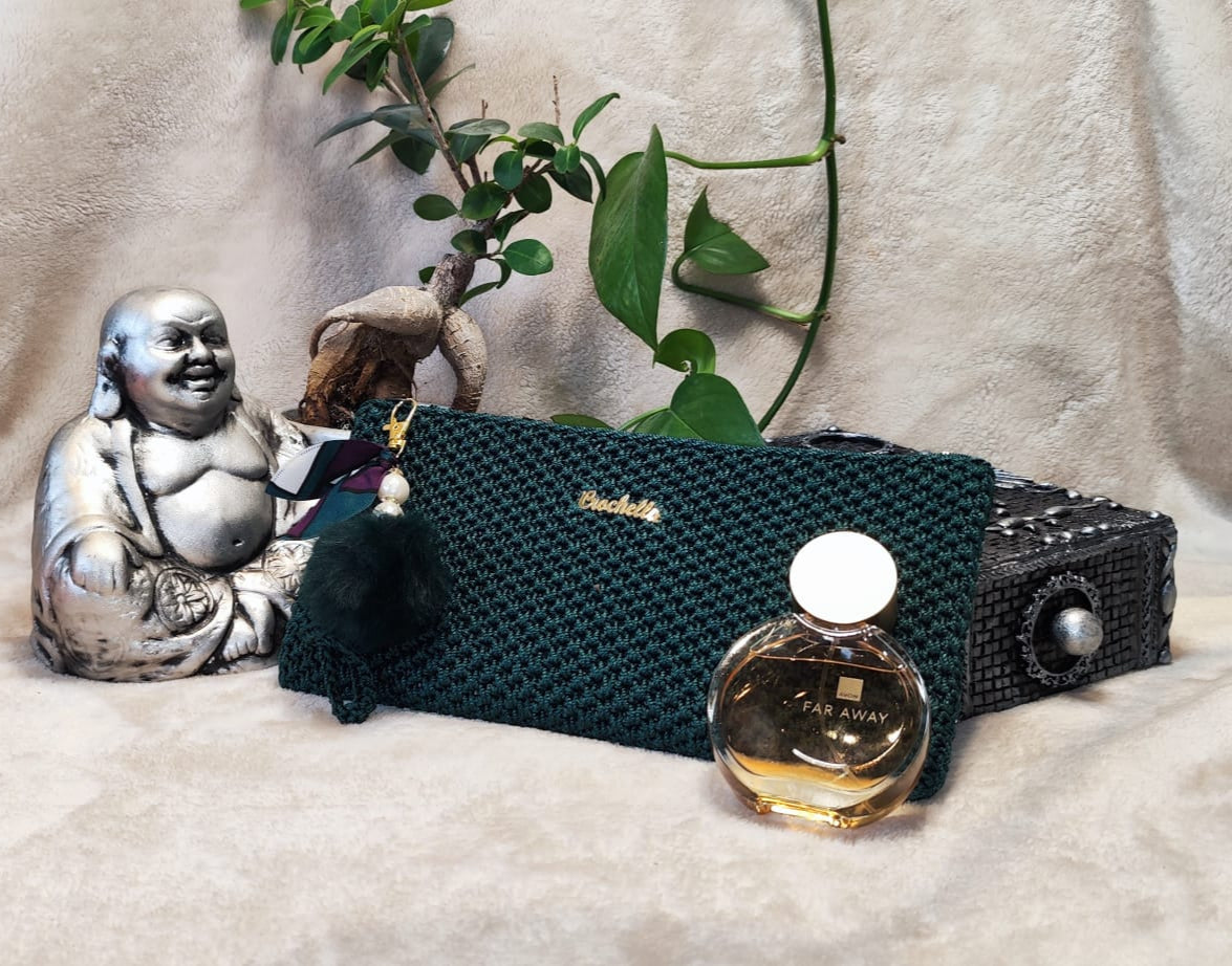 Sophisticated green Crochella Luxe Clutch with rich crochet texture.