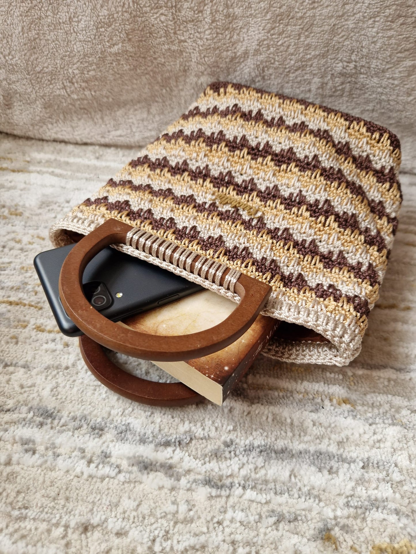 Detailed texture or styled view of the Caramel Twist Ember Stripes Bag, perfect for neutral-toned outfits.
