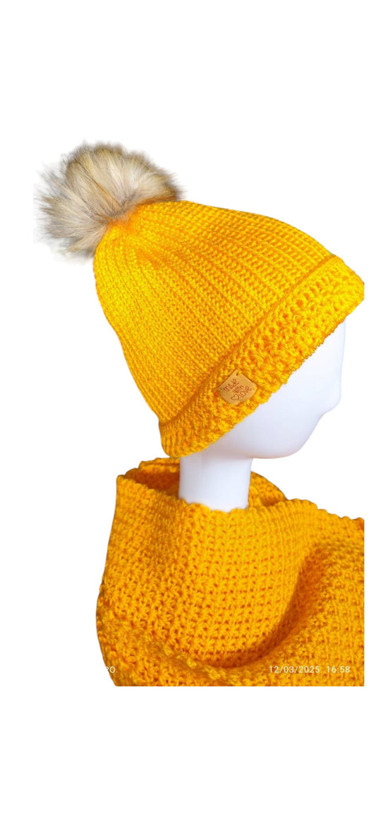 Angled view of the Golden Sun set, highlighting the slouchy fit of the beanie and the cozy drape of the scarf.
