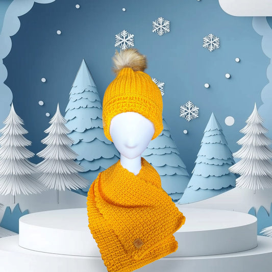 Golden Sun handmade crochet beanie and scarf set in vibrant yellow, styled on a mannequin with a cozy winter background.