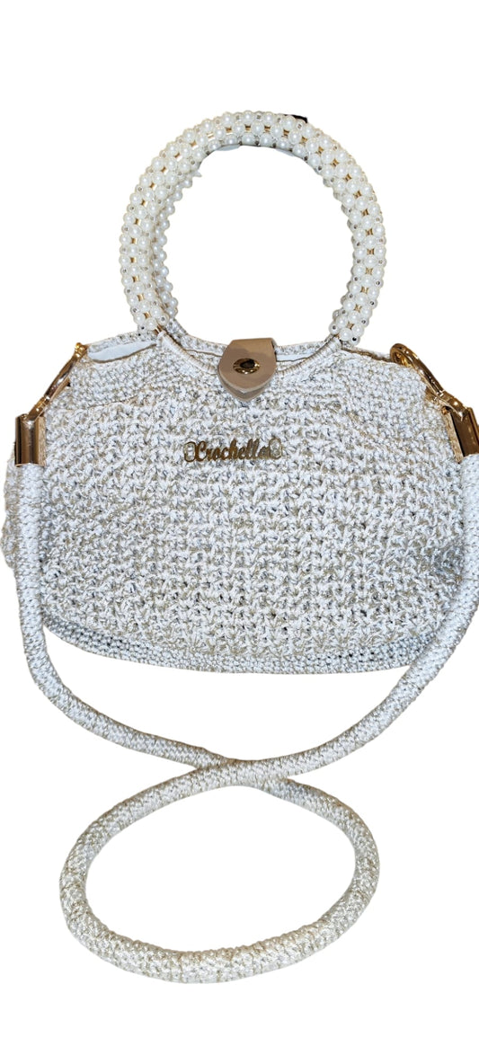 Pearl Luxe Bridal Crochet Bag with shimmering yarn, pearl beaded handles, and a gold Crochella logo, perfect for weddings or special occasions.