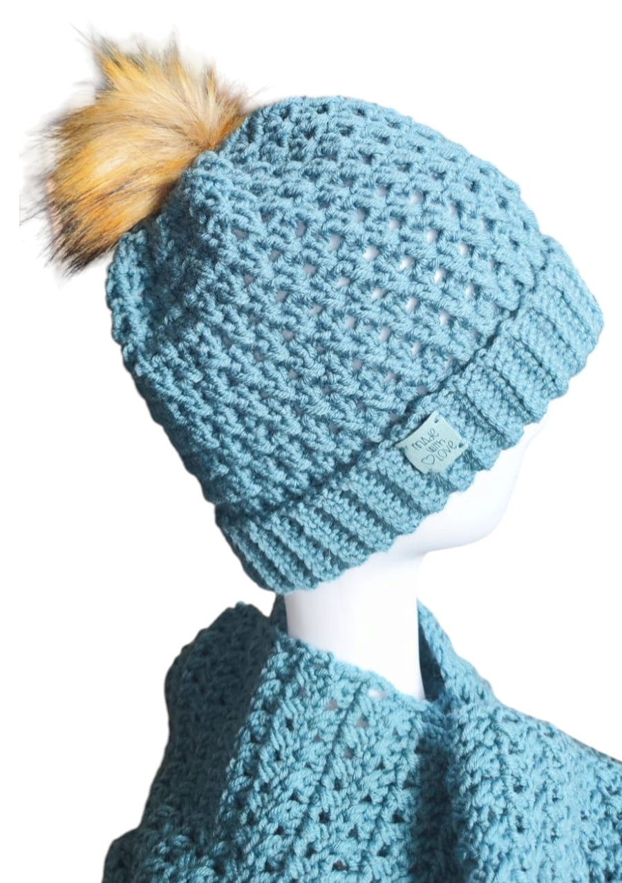 Angled view of the Sky Blue handmade beanie and scarf highlighting the thick cozy feel and soft yarn details.