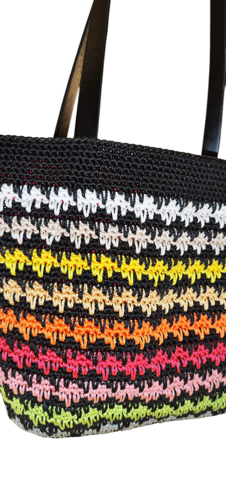 Angled shot of the Sunset Stripes Crochet Tote emphasizing its structure, size, and texture from side view.
