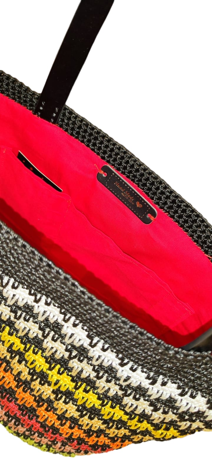 Close-up of the Sunset Stripes Tote’s rich gradient stitching and durable dark brown handles.