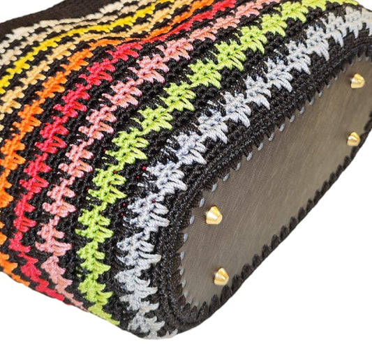 Flat lay of the Sunset Stripes Tote showing its rectangular shape and colorful crochet stitch pattern.