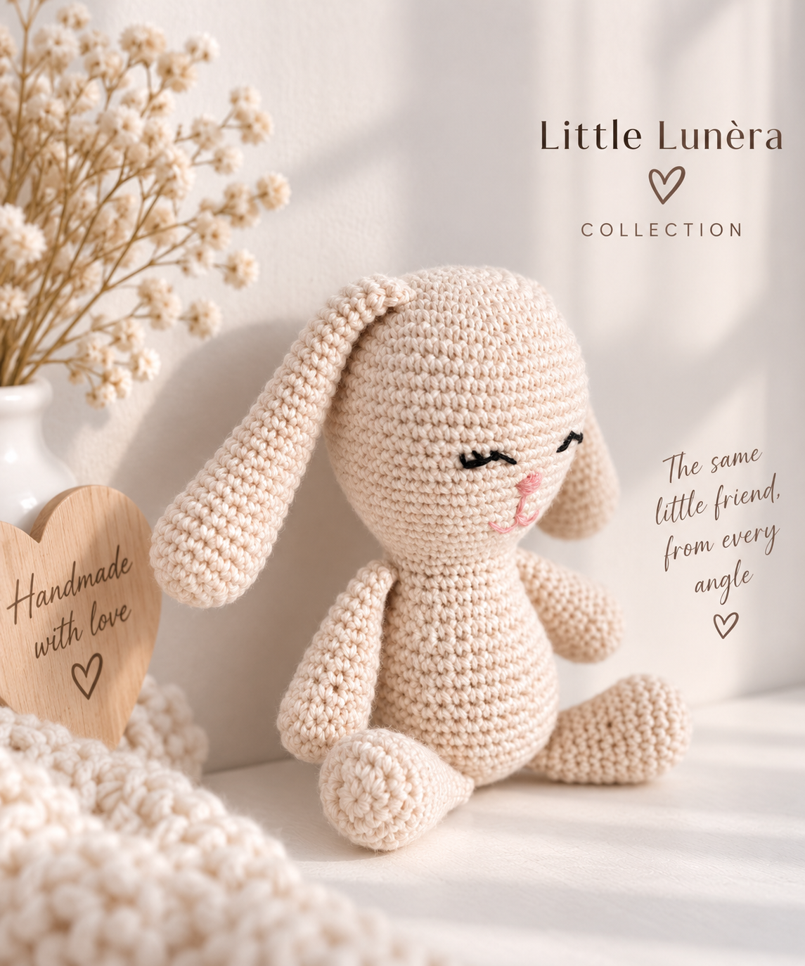 A crocheted bunny plush toy in a warm cream color, styled in a cozy setting with dried baby's breath in a white vase and a wooden heart-shaped sign that reads 'Handmade with love'. The text 'Little Lunéra COLLECTION' is visible in the upper right, along with promotional copy.
