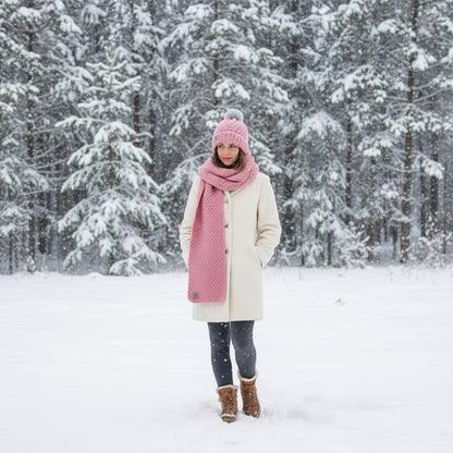 Blush Rose handmade crochet beanie and scarf set in soft pink, styled on a mannequin with a winter-themed backdrop.