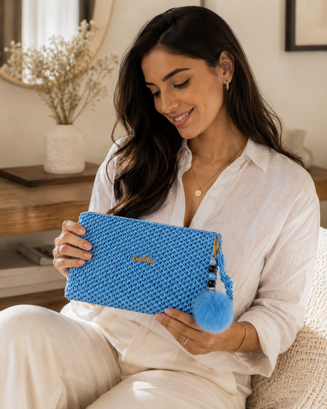 Handmade blue crochet pouch with textured stitching and relaxed luxury styling