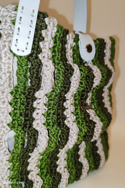 Angled look at the Forest Waves Bag showcasing its 3D pattern and rich green tones with a modern silhouette.