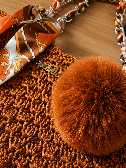 Decorative pompom and crochet craftsmanship detail on the MK Lunèra Crochella Amber Luxe Handbag
