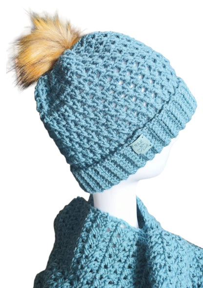  Angled view of the Sky Blue handmade beanie and scarf highlighting the thick cozy feel and soft yarn details.
