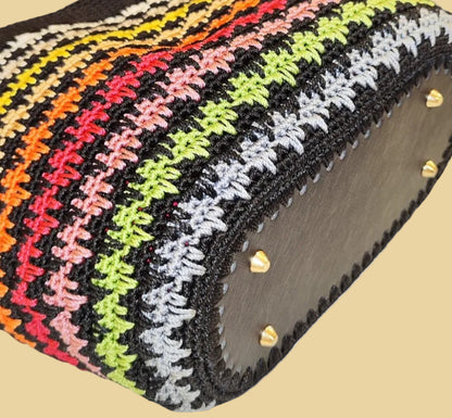  Flat lay of the Sunset Stripes Tote showing its rectangular shape and colorful crochet stitch pattern.